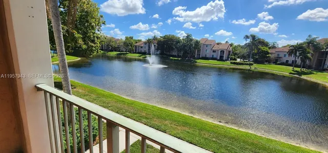 a view of swimming pool from a balcony