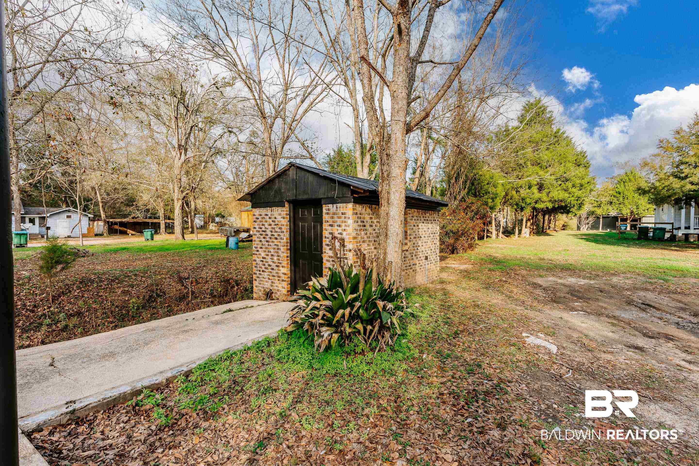 1190 Military Road Mount Vernon, AL 36560 - Photo 43 of 47 View of green lawn featuring an outbuilding