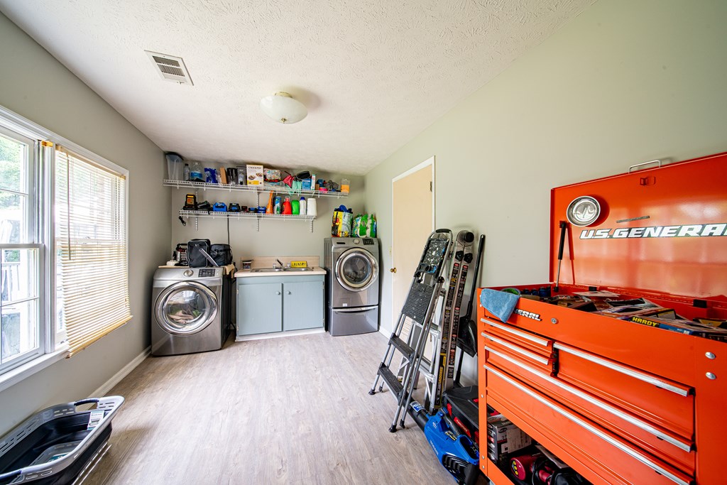 6717 Moon Circle Columbus, GA 31909 - Photo 22 of 32 Laundry room with full bath off garage