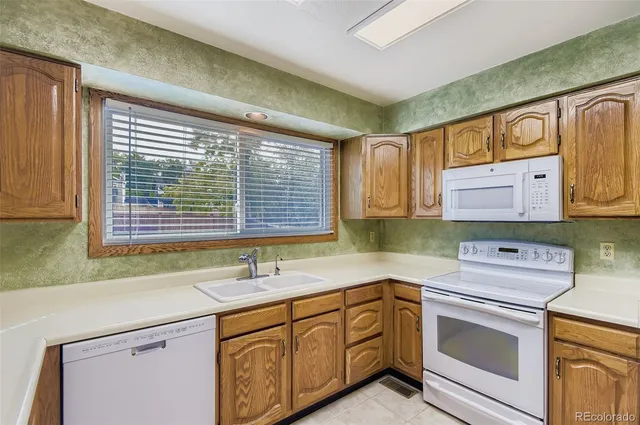a view of empty room with fireplace and wooden floor