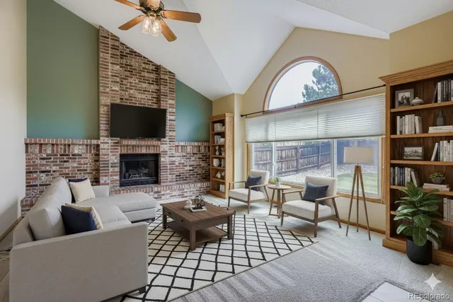 a spacious bedroom with a bed and a flat tv screen