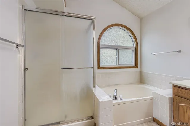 a living room with furniture a rug and a window