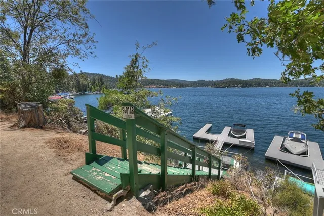 a view of a deck with mountain view and a lake view