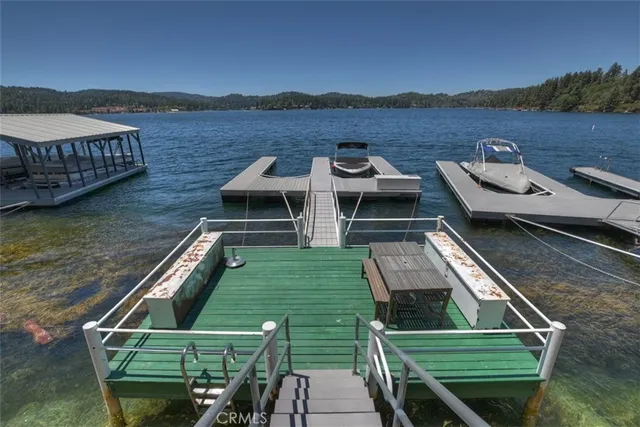 a view of a wooden deck and lake view
