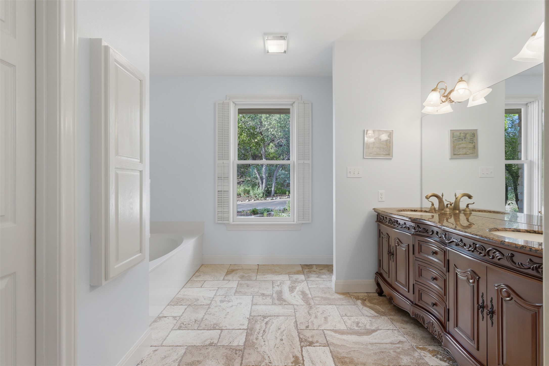 1504 Twilight Ridge Drive Austin, TX 78746 - Photo 15 of 30 Primary bath has all the spaces. For the right contract, seller will consider decor allowance.