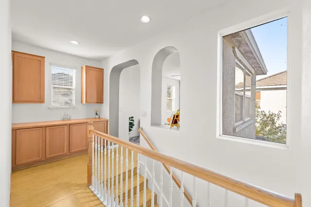 a bathroom with a double vanity sink a mirror and a shower