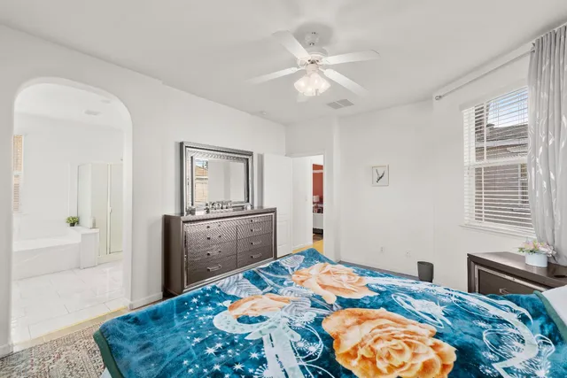 a view of walk in closet with clothes