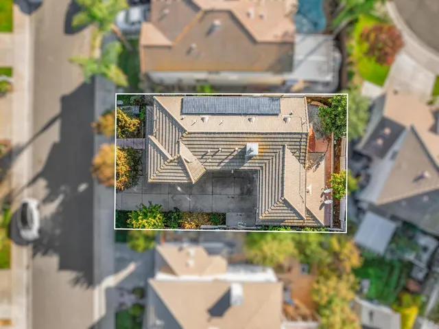 an aerial view of residential building and ocean