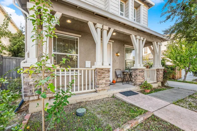 a front view of a house with large garden