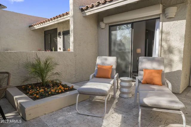 a outdoor living space with furniture and a fireplace