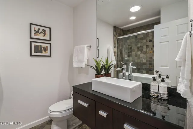 a bathroom with a shower and a bathtub