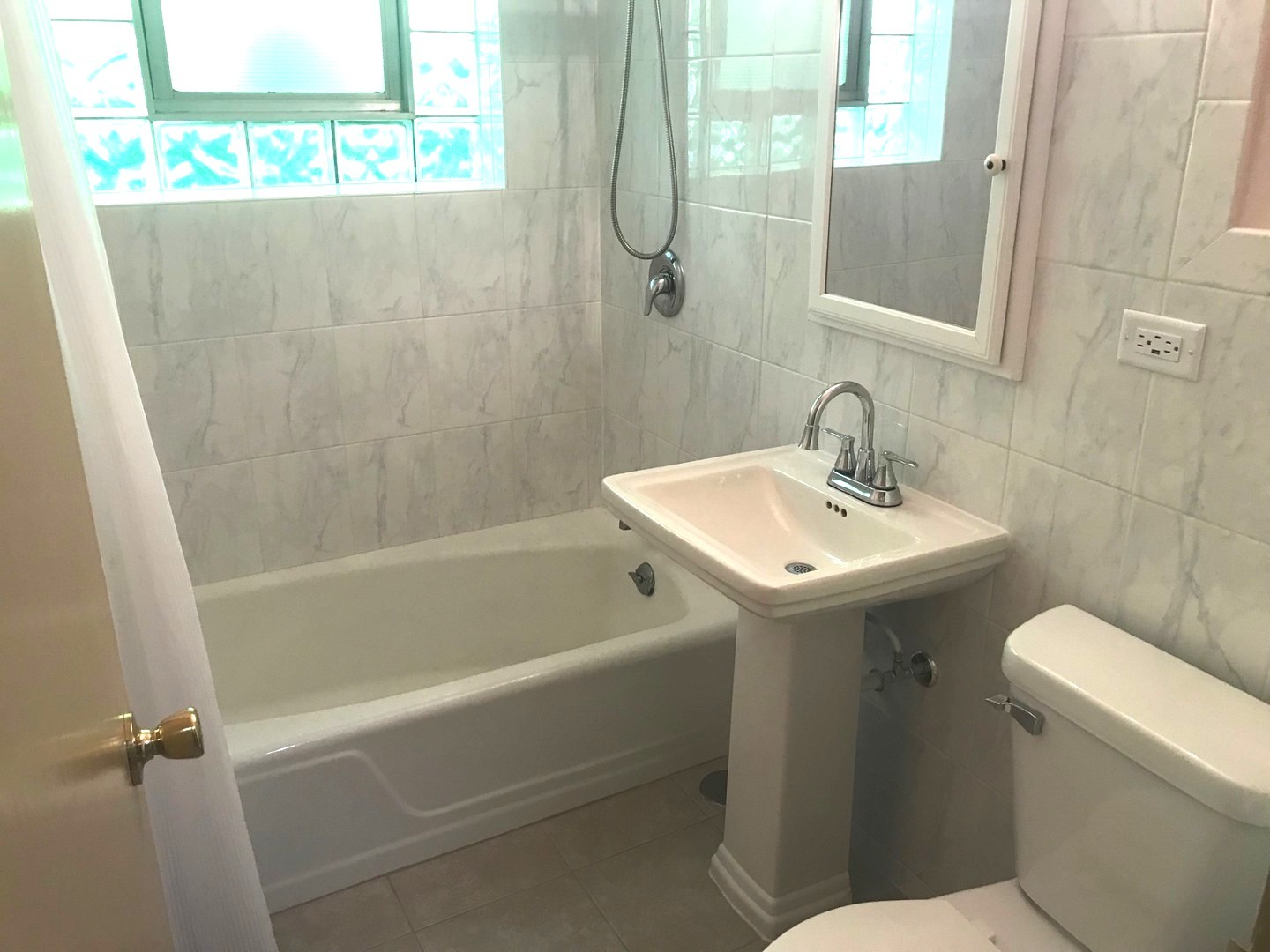 725 Busse Highway, Unit 10 Park Ridge, IL 60068 - Photo 30 of 37 a bathroom with a sink a toilet and shower