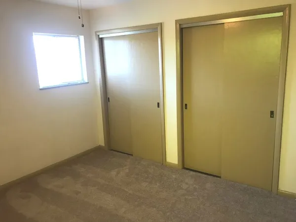 an empty room with windows