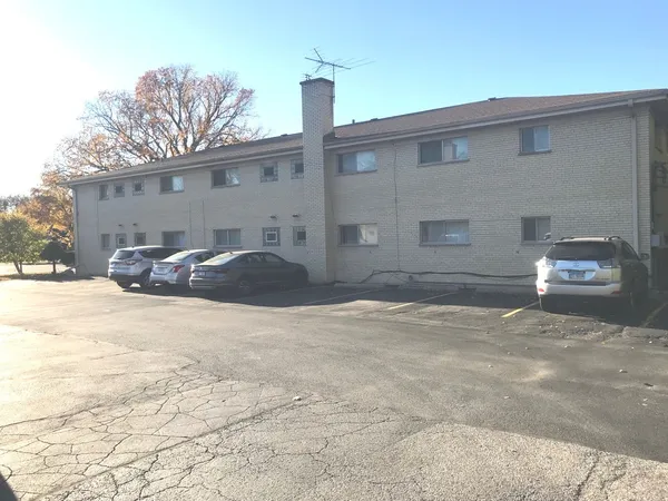 a front view of a house with parking yard