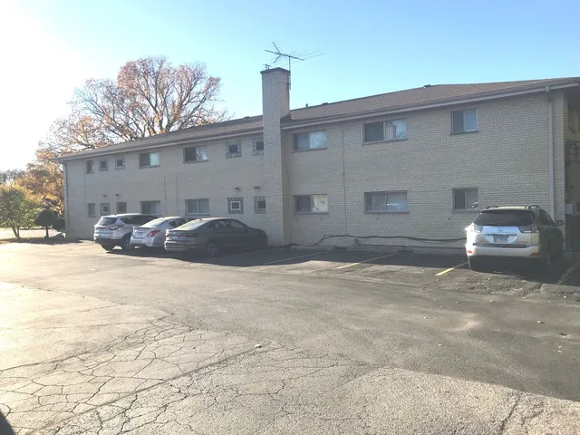 a front view of a house with parking yard