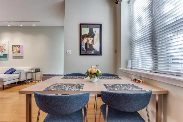 a dining room with a table and chairs