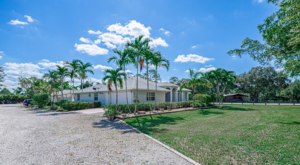 1858 F Road Loxahatchee Groves, FL 33470 - Photo 3 of 87 driveway