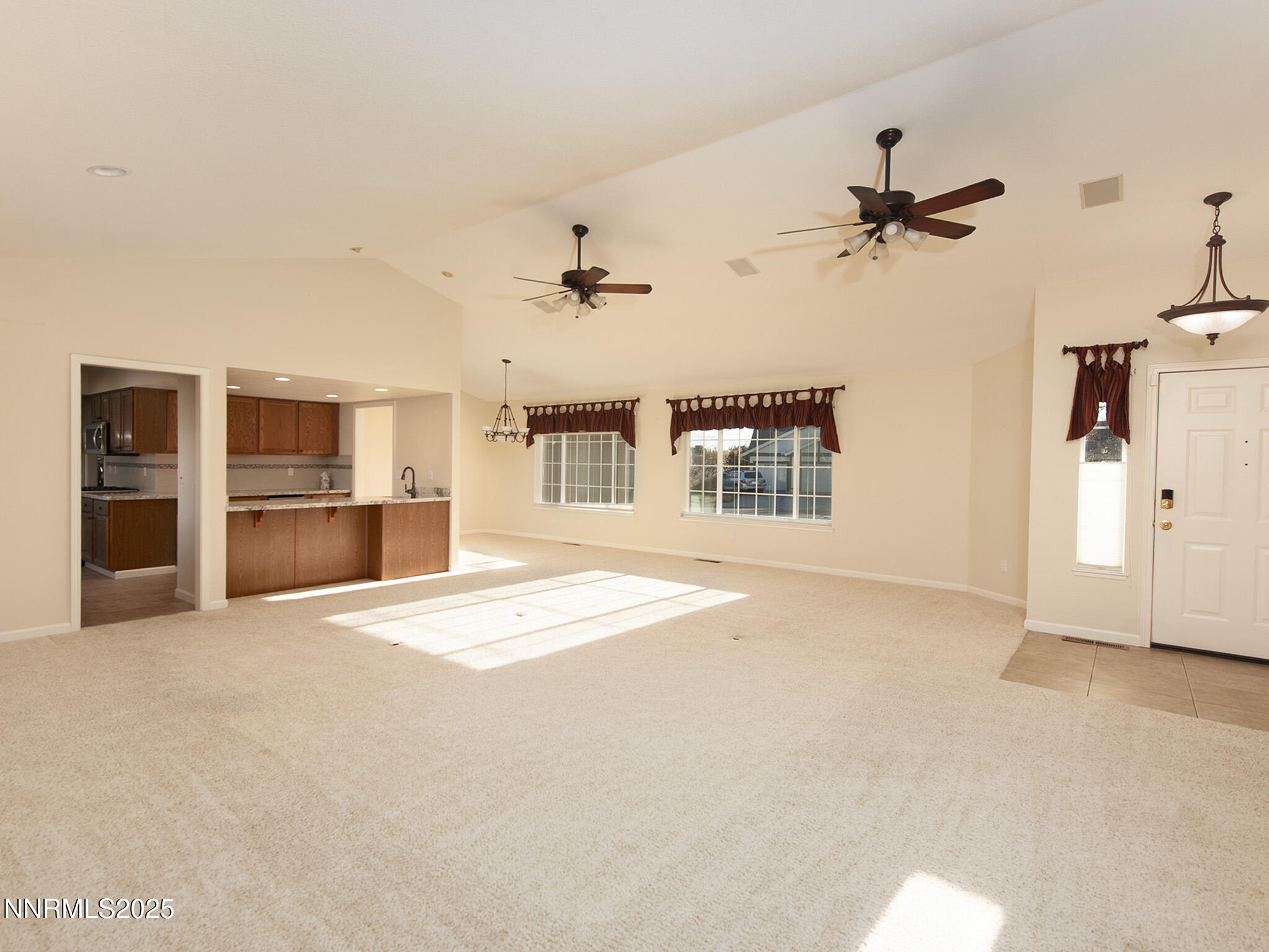 25 Nives Court Sparks, NV 89441 - Photo 11 of 67 a view of an empty room with a kitchen