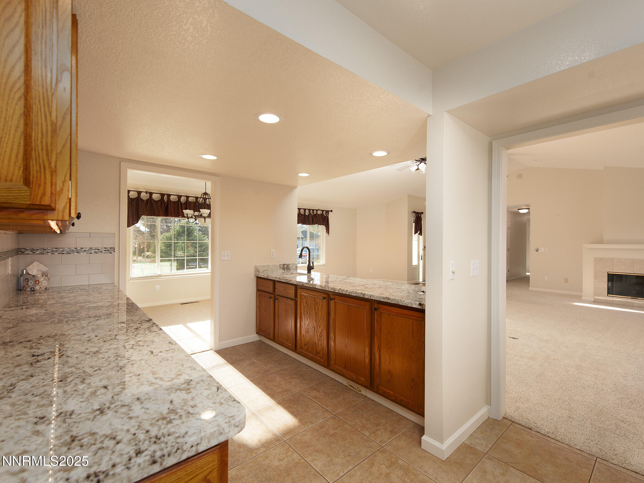 25 Nives Court Sparks, NV 89441 - Photo 17 of 67 a large kitchen with kitchen island a sink stainless steel appliances and cabinets