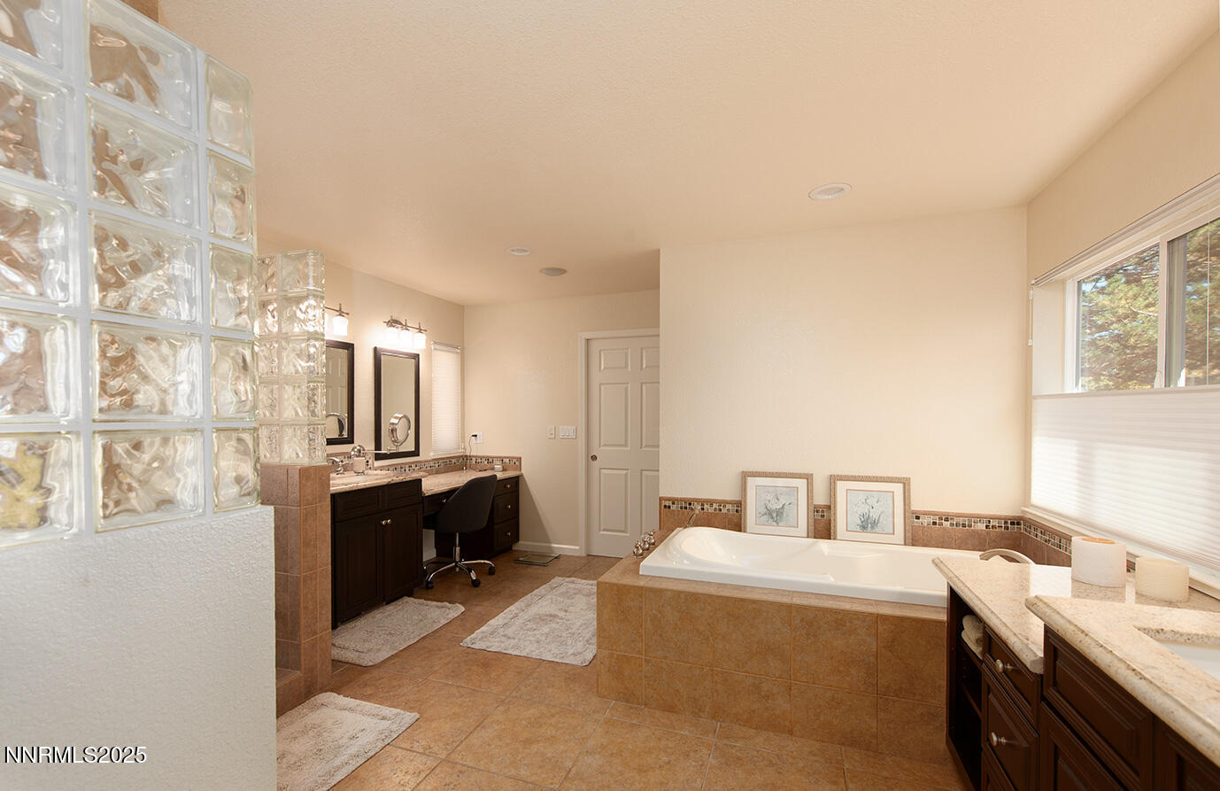 25 Nives Court Sparks, NV 89441 - Photo 21 of 67 a bedroom with a bed and furniture