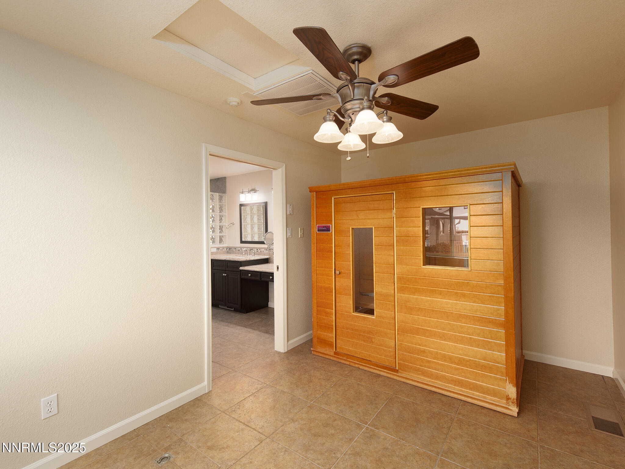 25 Nives Court Sparks, NV 89441 - Photo 23 of 67 a view of a livingroom with a chandelier fan and windows