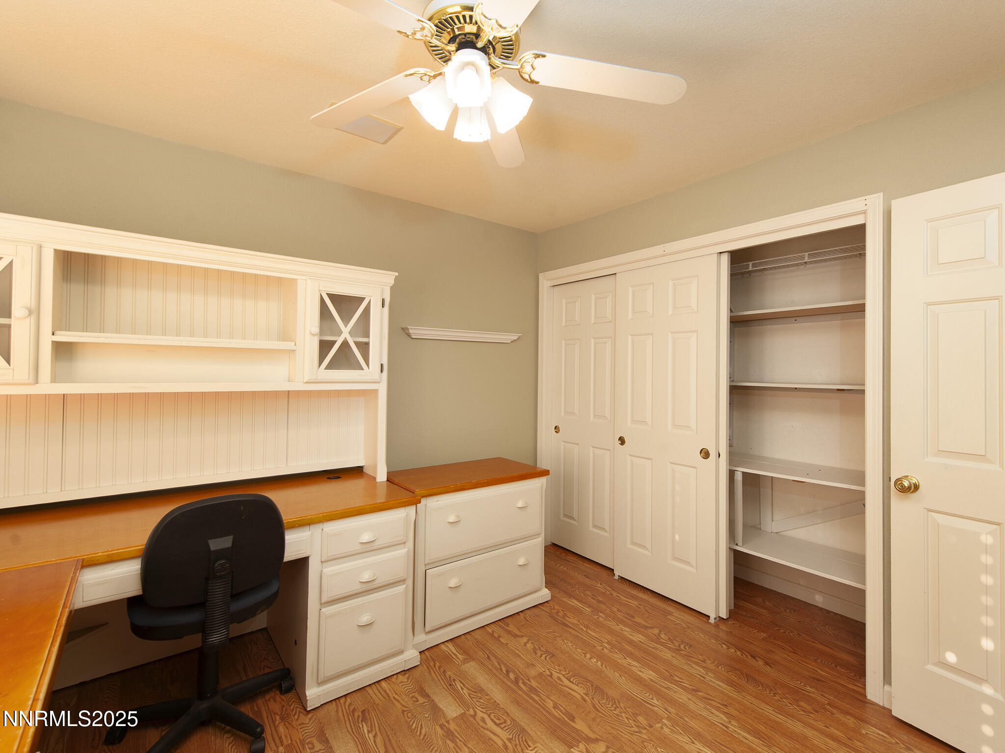 25 Nives Court Sparks, NV 89441 - Photo 27 of 67 a kitchen with a refrigerator and a cabinets