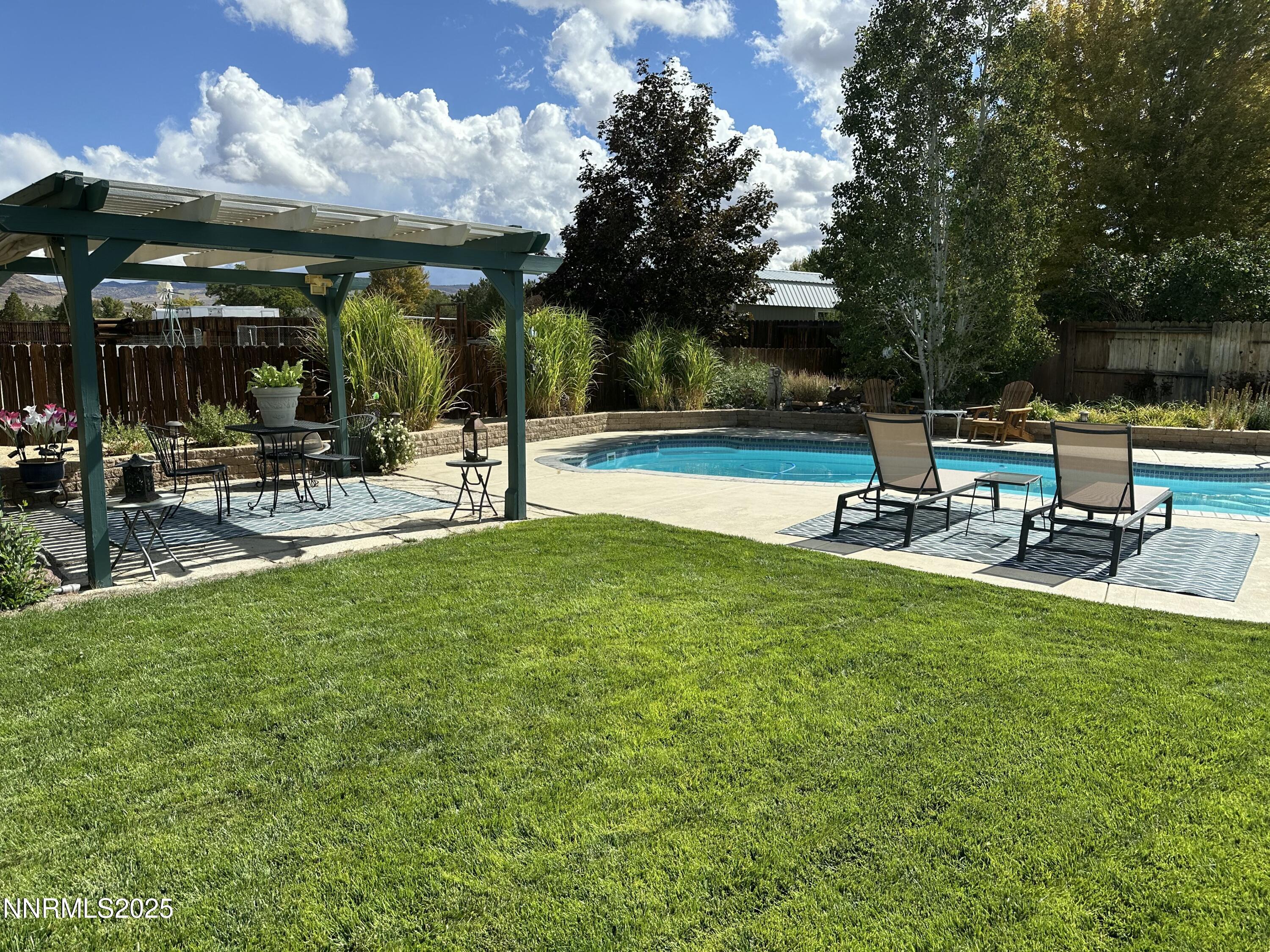 25 Nives Court Sparks, NV 89441 - Photo 39 of 67 a view of a patio with a table and chairs