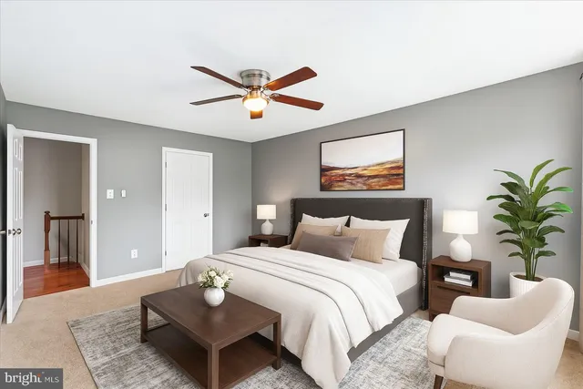 a bedroom with a bed furniture and a window