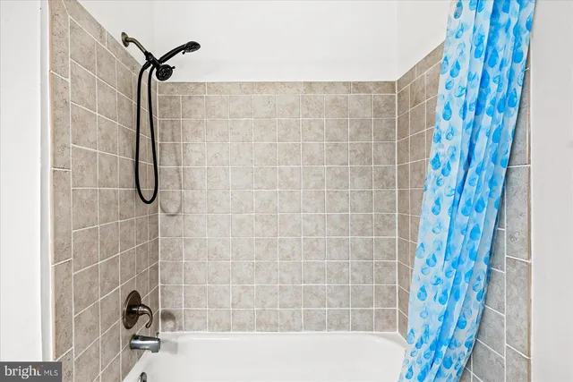 a bathroom with a bath tub