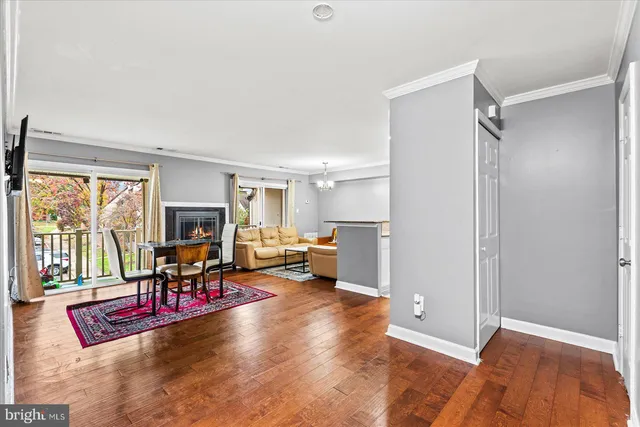 a view of a livingroom with workspace and a window