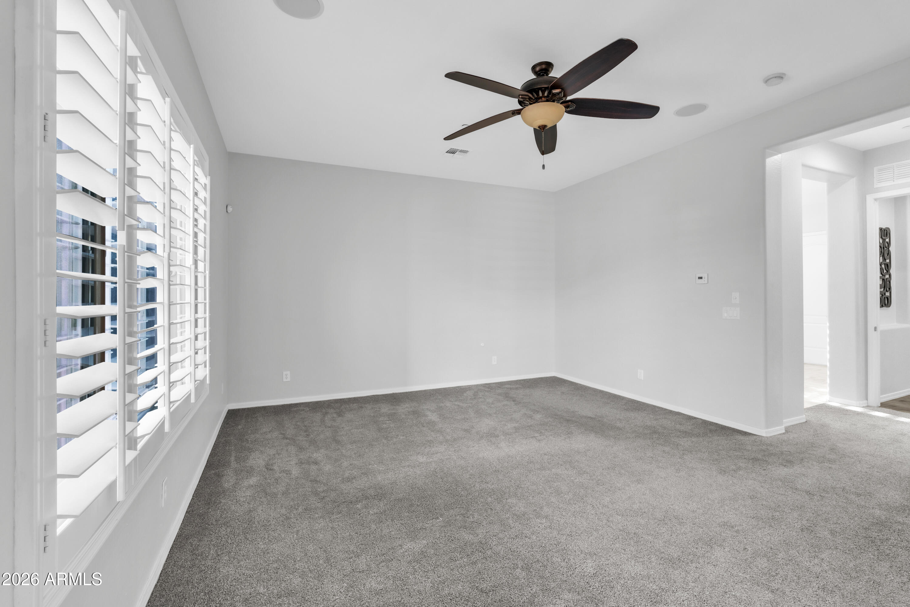 1615 West Red Fox Road Phoenix, AZ 85085 - Photo 28 of 64 a view of an empty room with a window