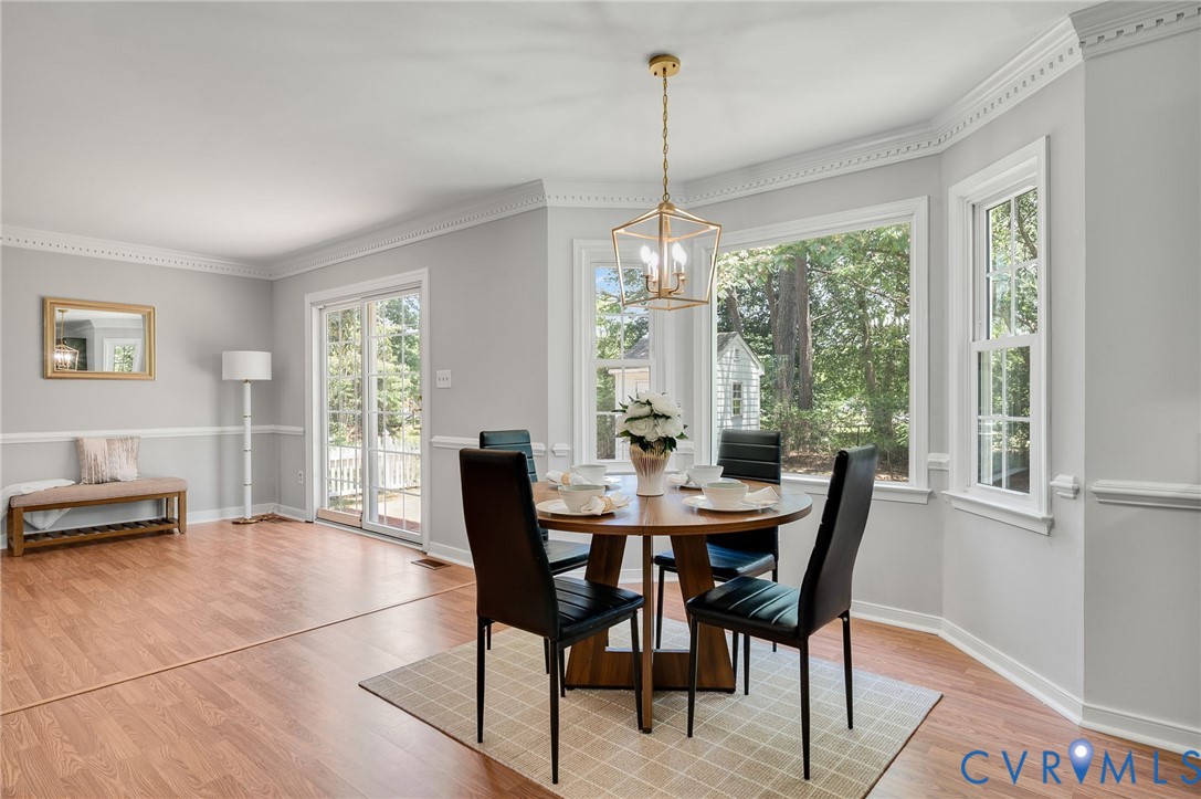 10110 Holly Road Mechanicsville, VA 23116 - Photo 12 of 26 Bay window dining area with gold-finish geometric