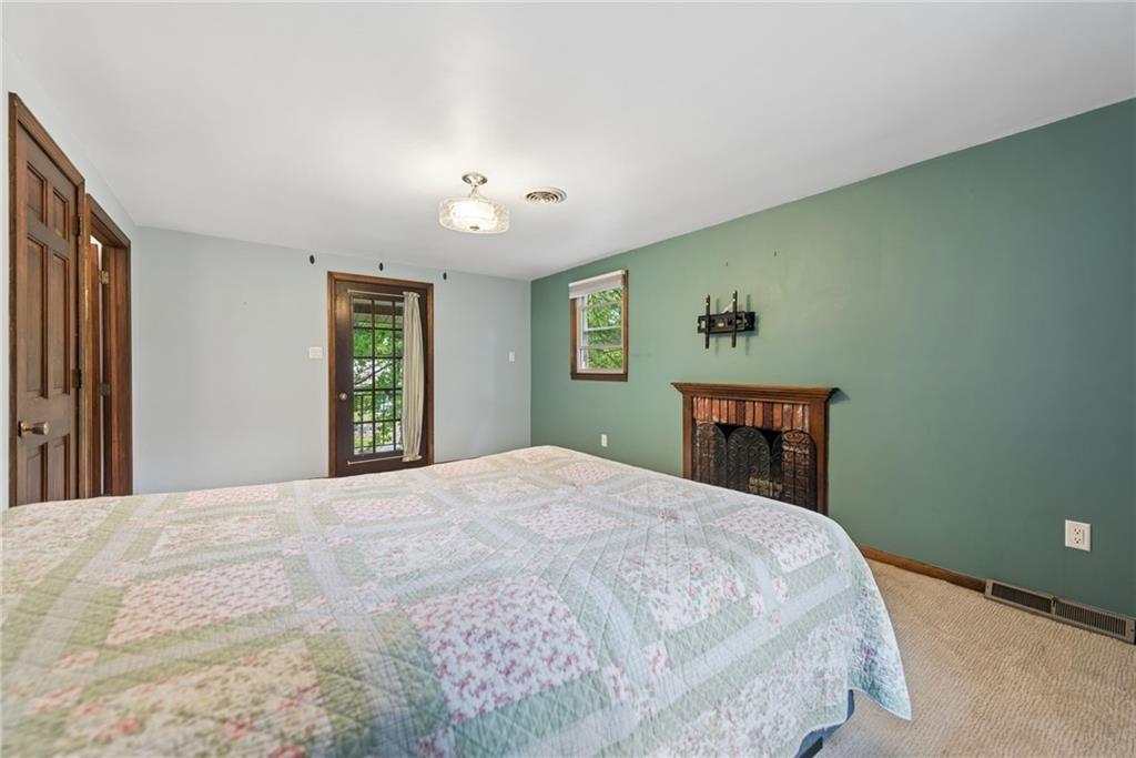 22 Buzzardtown Road Irwin, PA 15642 - Photo 19 of 44 a bedroom with a large bed and a window