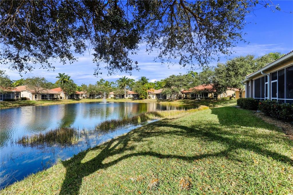 8133 Chancel Court, Unit 641 Naples, FL 34104 - Photo 1 of 13 a view of a lake with a mountain in the background
