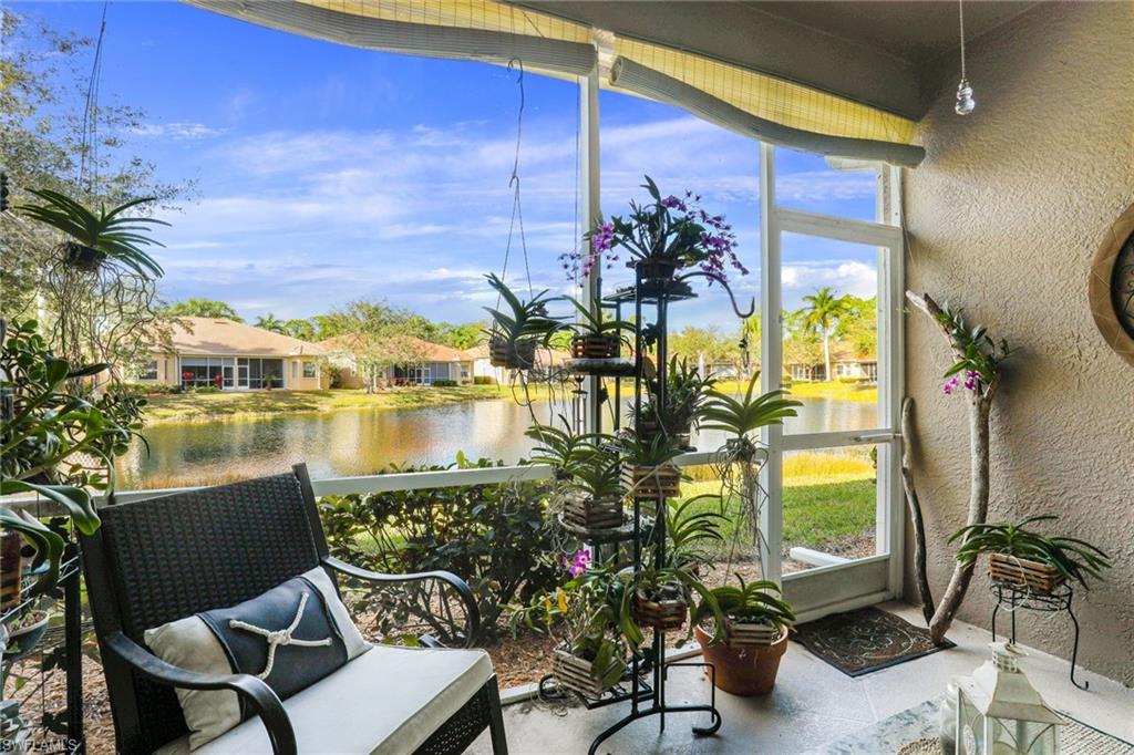 8133 Chancel Court, Unit 641 Naples, FL 34104 - Photo 12 of 13 a view of a chairs and table in a patio