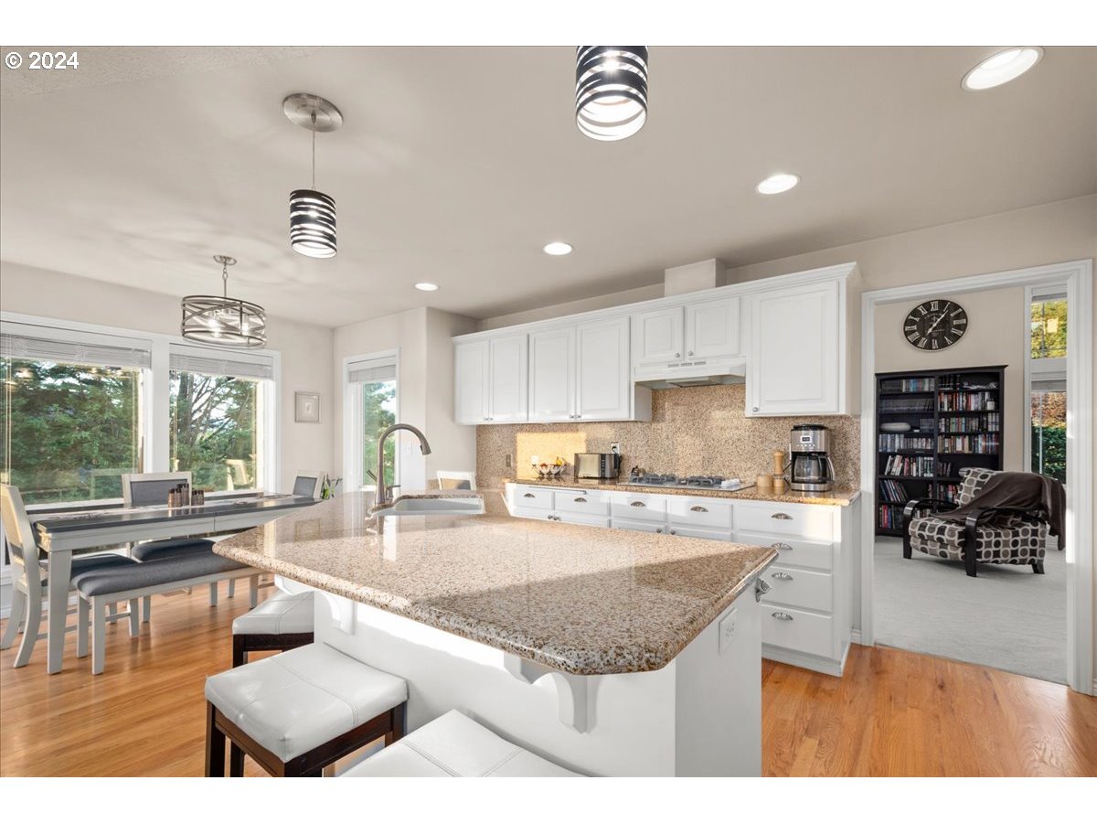 2509 Northwest 36th Avenue Camas, WA 98607 - Photo 12 of 48 a kitchen with stainless steel appliances granite countertop a stove and a refrigerator