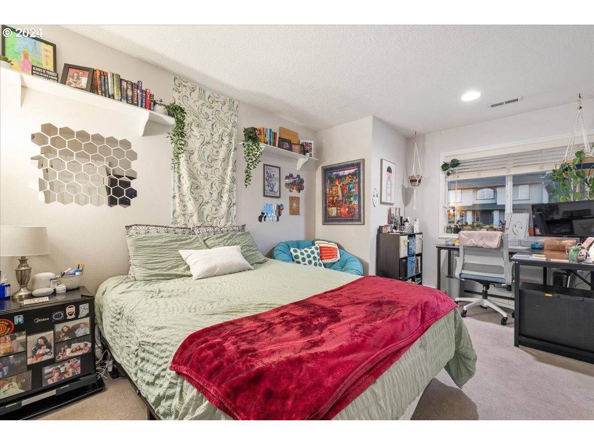 2509 Northwest 36th Avenue Camas, WA 98607 - Photo 29 of 48 a bed room with a bed window and a chair in it