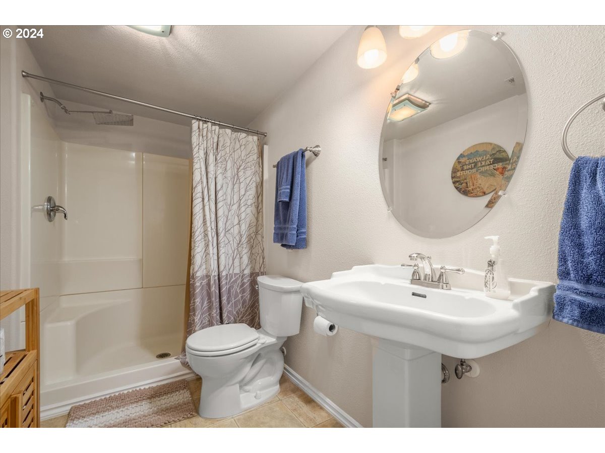 2509 Northwest 36th Avenue Camas, WA 98607 - Photo 37 of 48 a bathroom with a sink toilet and shower