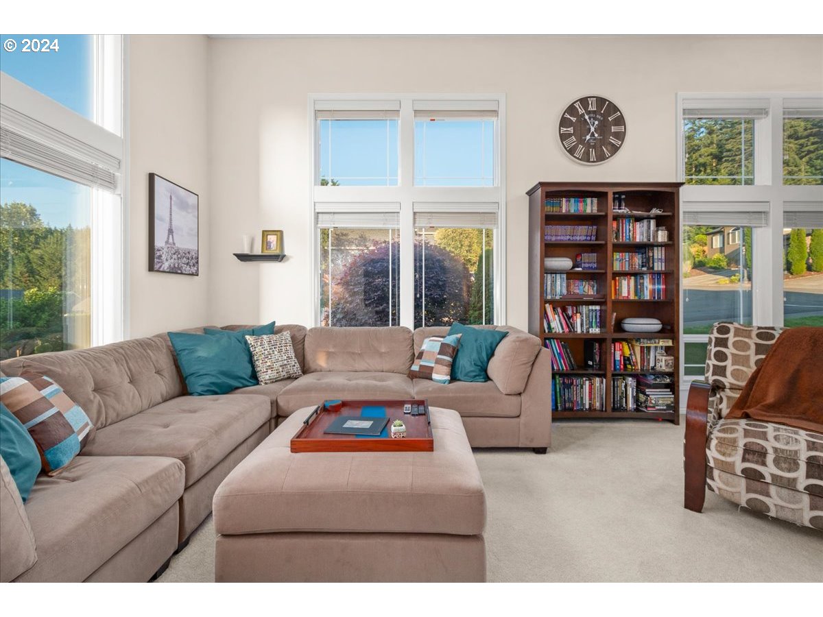 2509 Northwest 36th Avenue Camas, WA 98607 - Photo 8 of 48 a living room with furniture a bookshelf and a window