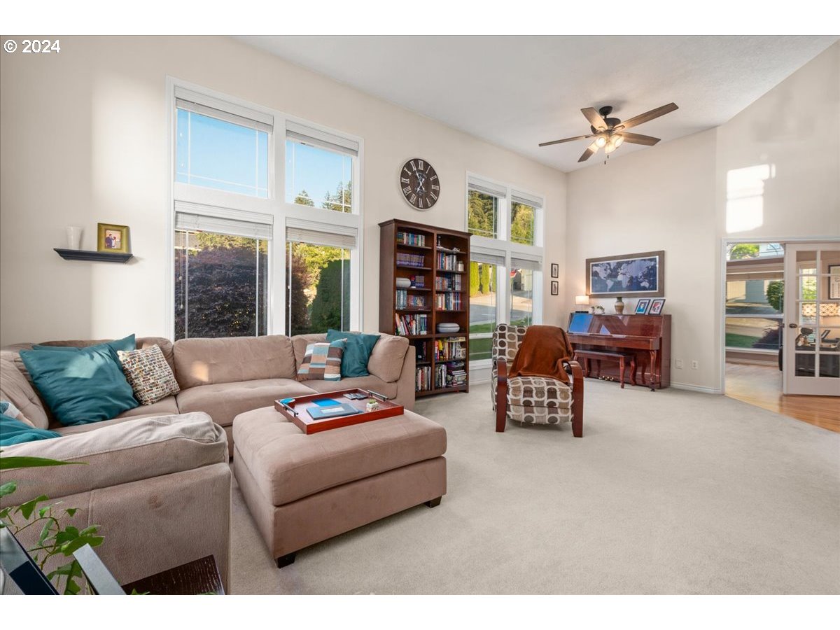 2509 Northwest 36th Avenue Camas, WA 98607 - Photo 9 of 48 a living room with furniture and a chandelier