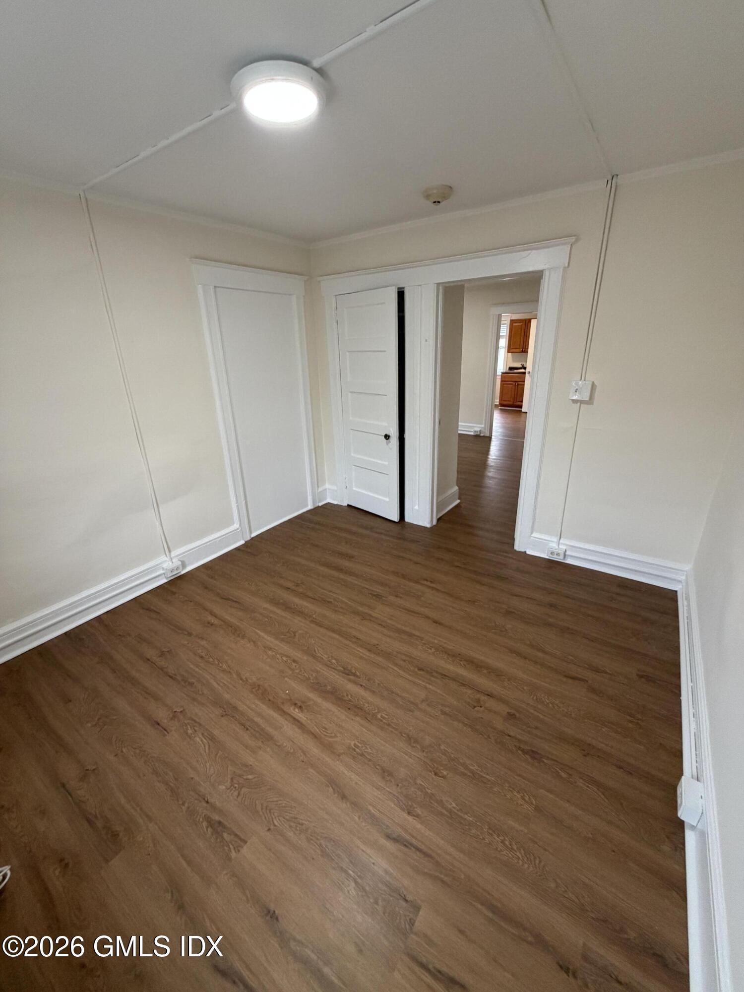 140 Hamilton Avenue, Unit 2 Greenwich, CT 06830 - Photo 8 of 10 a view of empty room with wooden floor