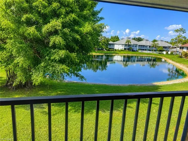 a view of a lake with a big yard