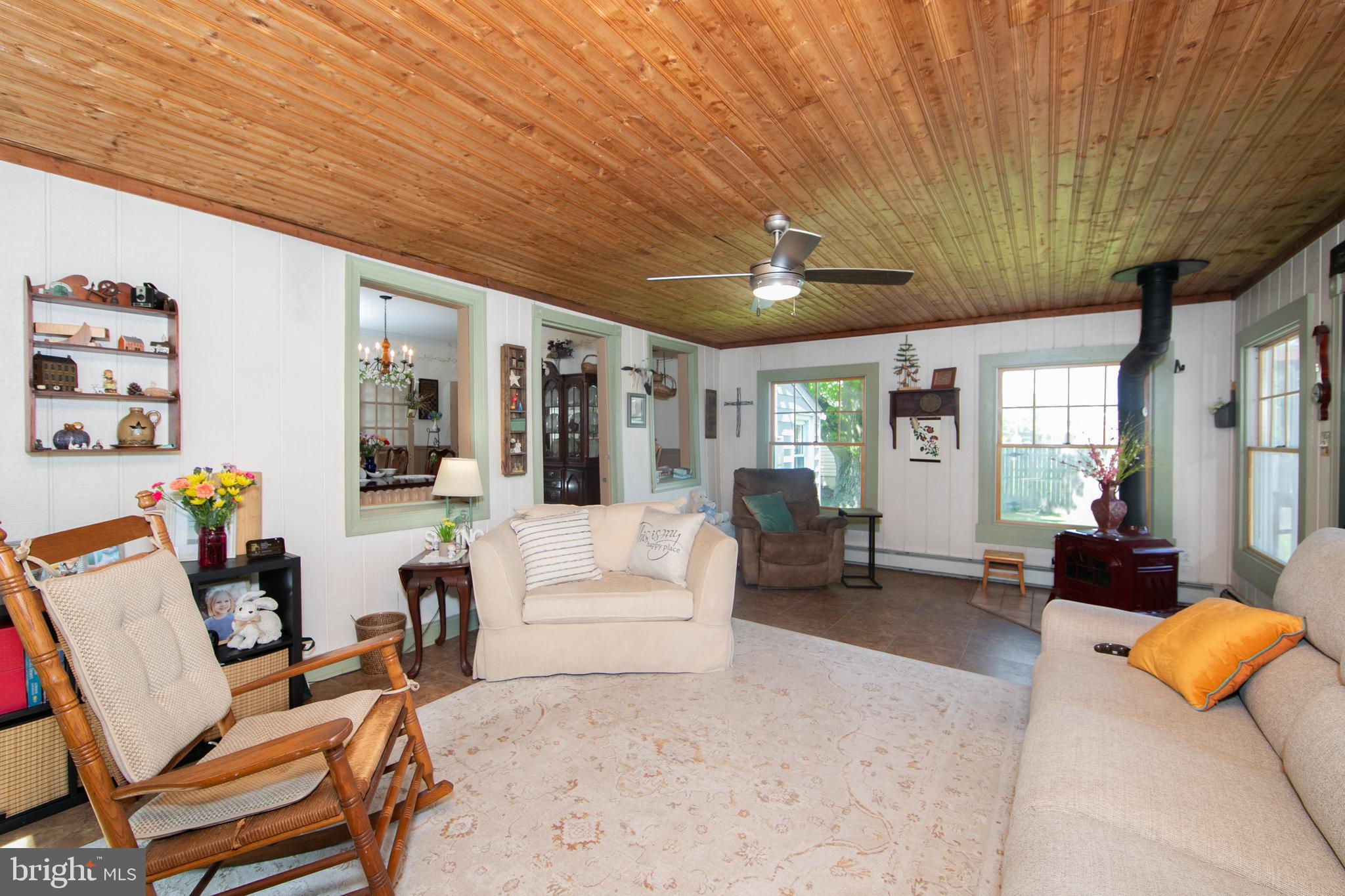 86 Kansas Road Pennsville, NJ 08070 - Photo 16 of 46 a living room with furniture a couch and potted plant with wooden floor