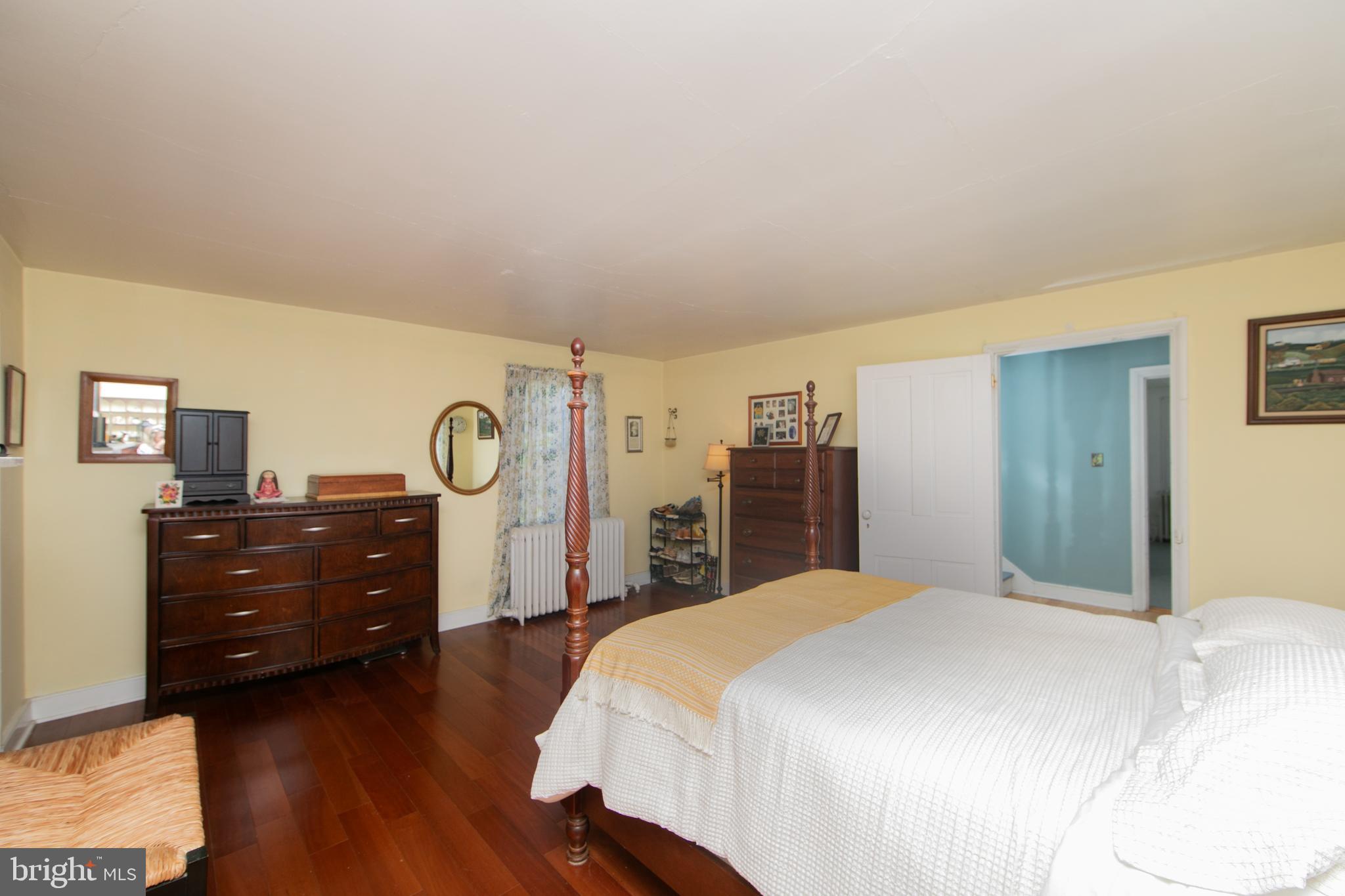 86 Kansas Road Pennsville, NJ 08070 - Photo 24 of 46 a bedroom with a bed and a mirror