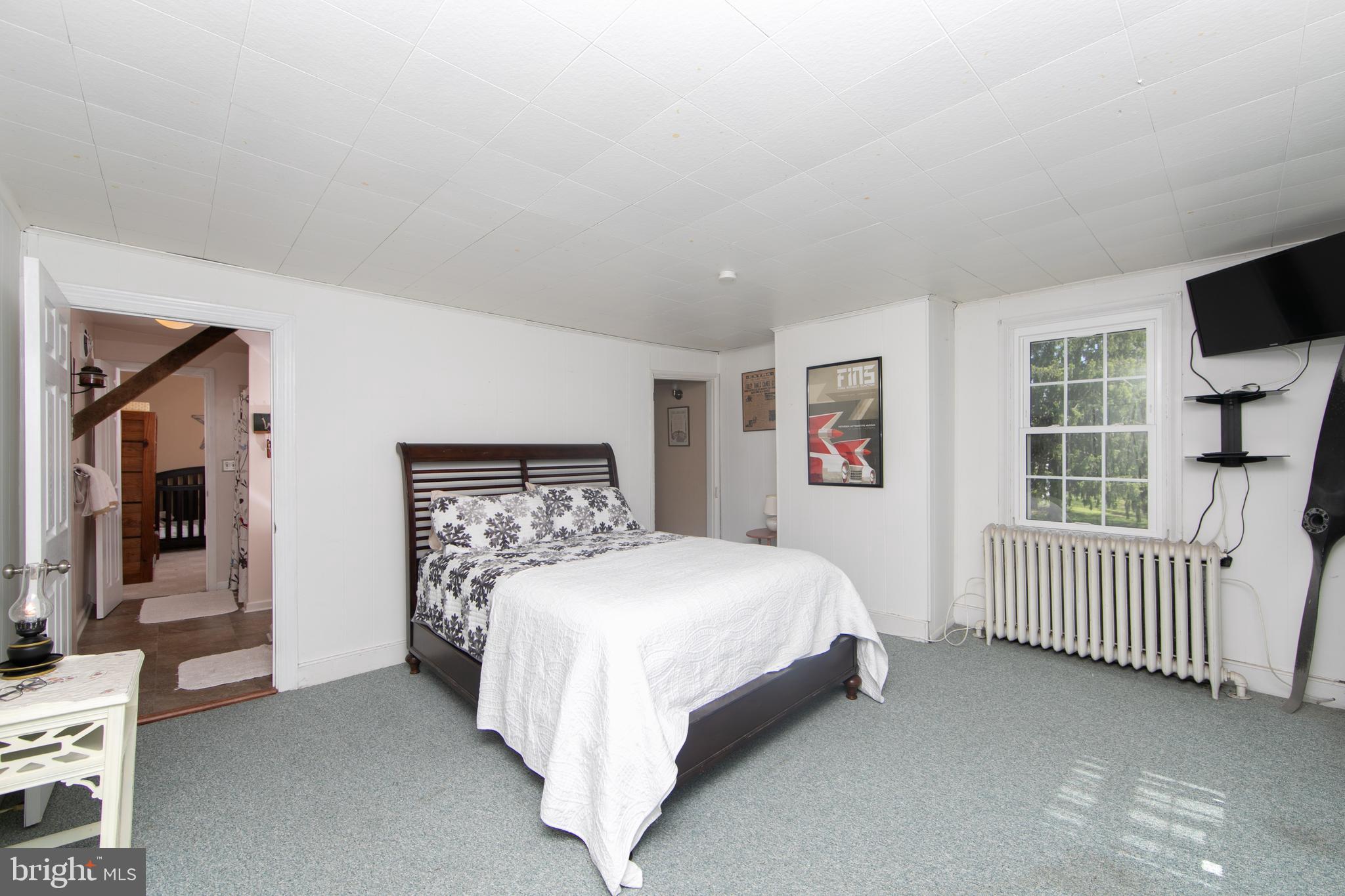 86 Kansas Road Pennsville, NJ 08070 - Photo 25 of 46 a bedroom with a bed and a night stand