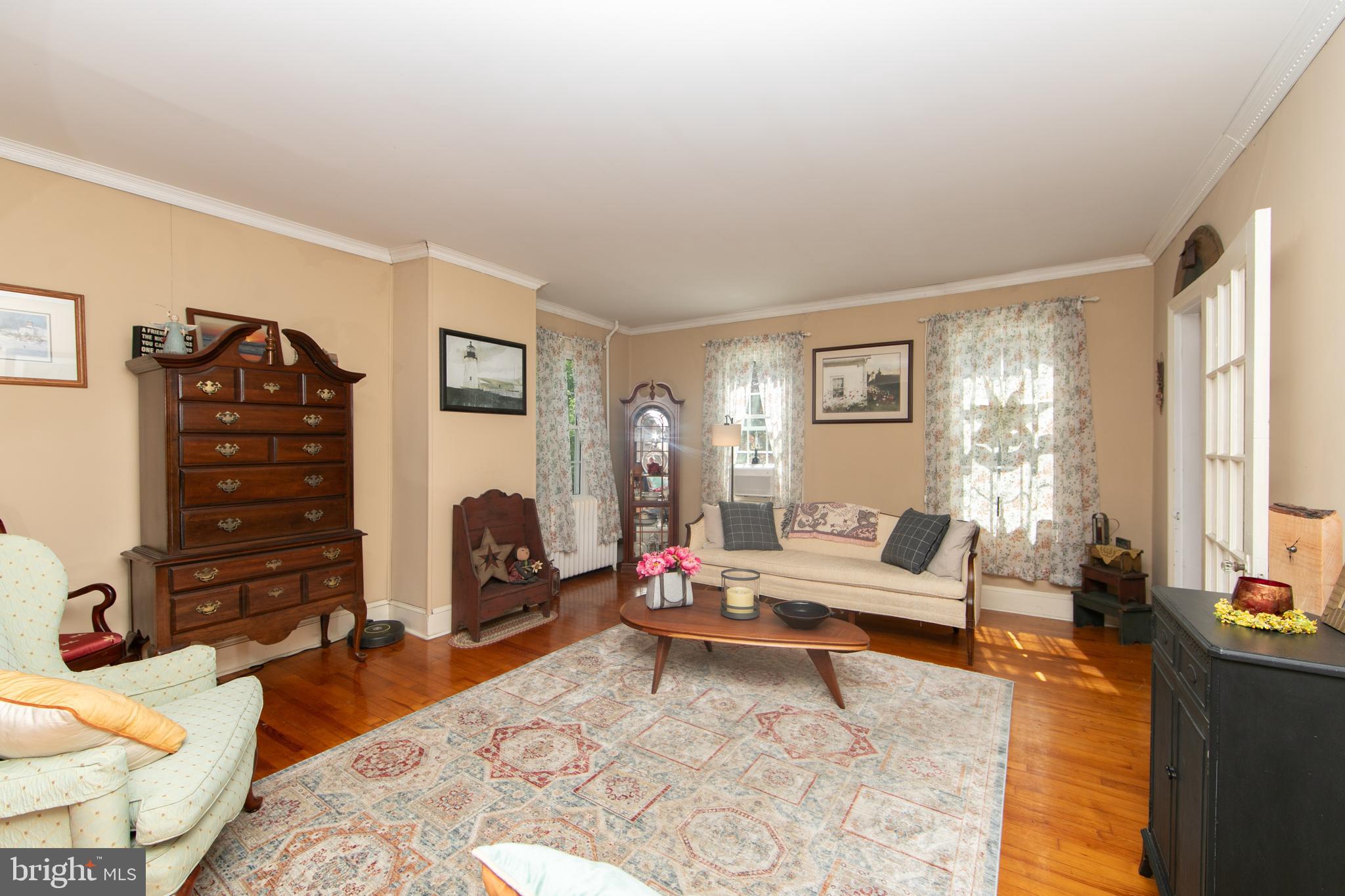 86 Kansas Road Pennsville, NJ 08070 - Photo 4 of 46 a living room with furniture a lamp and a fireplace