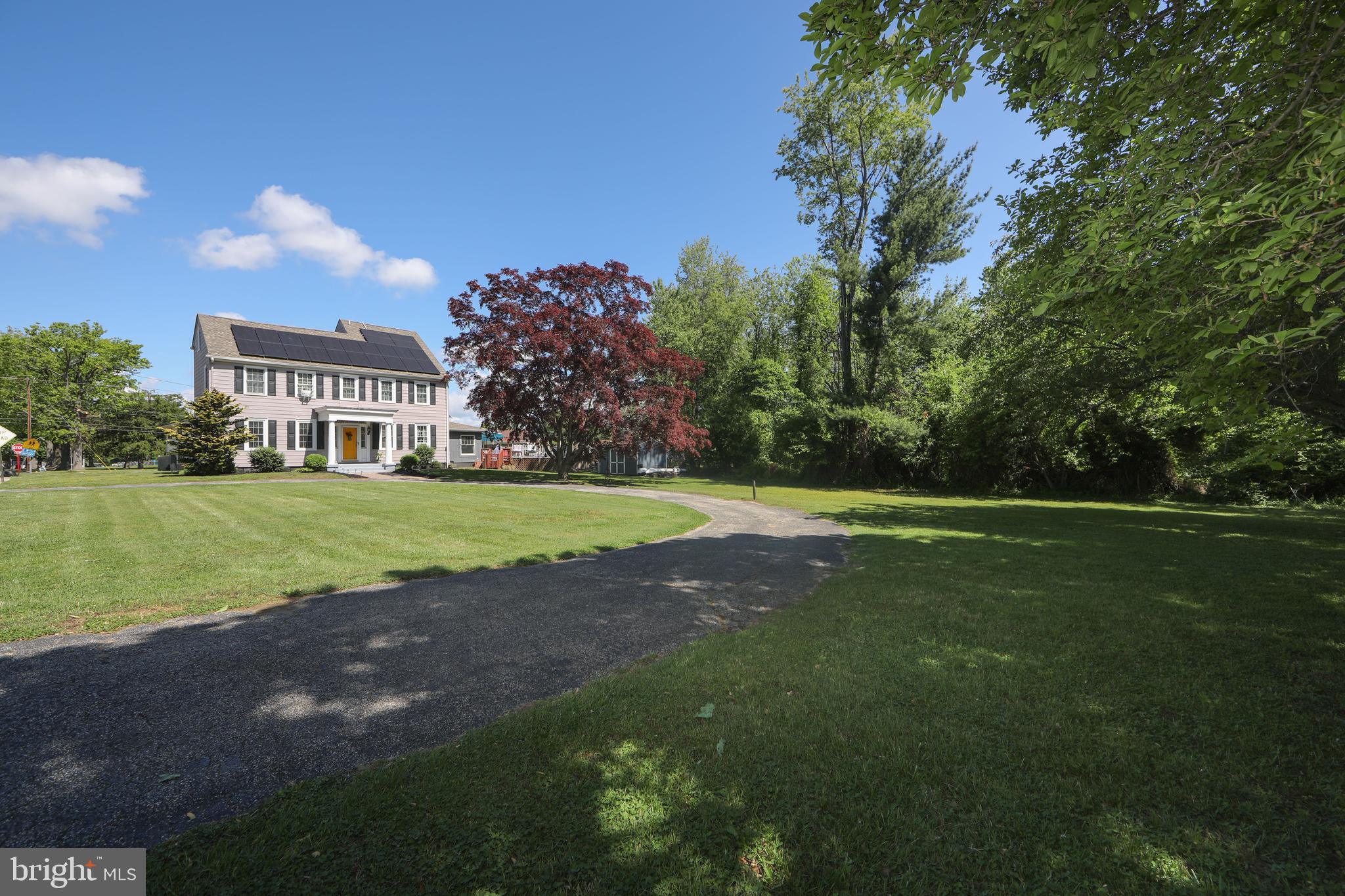 86 Kansas Road Pennsville, NJ 08070 - Photo 45 of 46 a view of building with garden