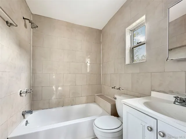 a bathroom with a sink toilet and bathtub