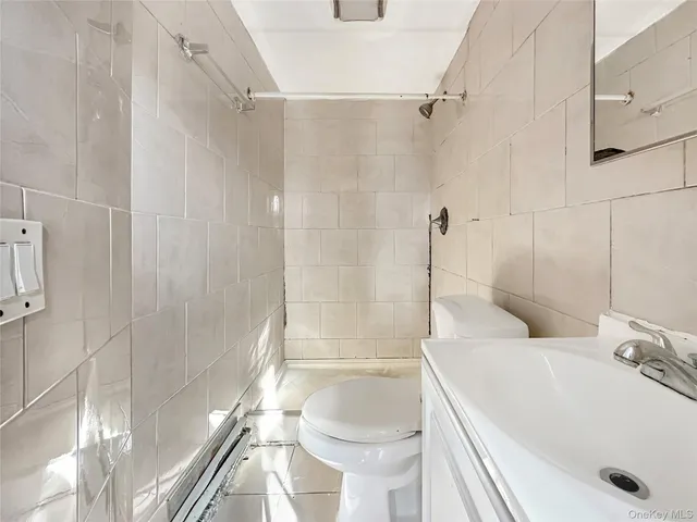 a bathroom with a tub and a shower