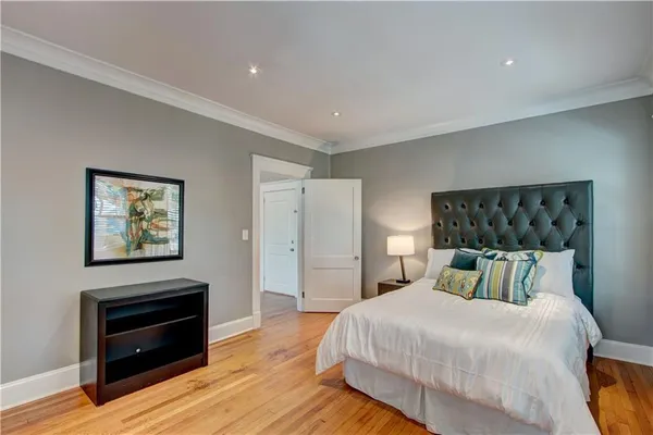 a bedroom with a bed and a television